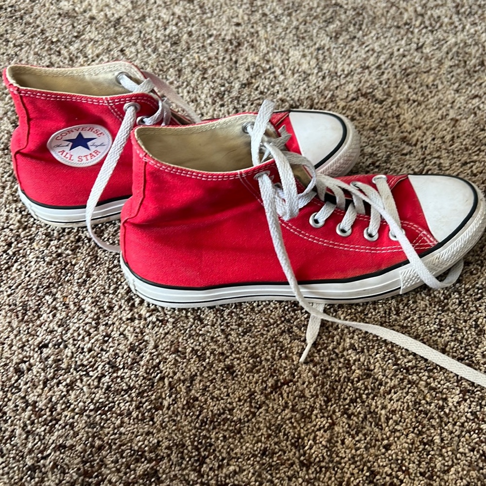 Red high top converse all star sneakers